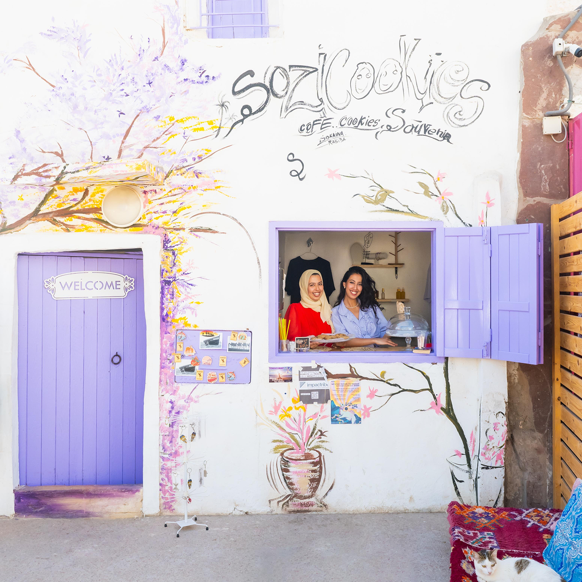 Soukaina and Rabia at the lilac window of their Sozi Cookies shop in Taghazout