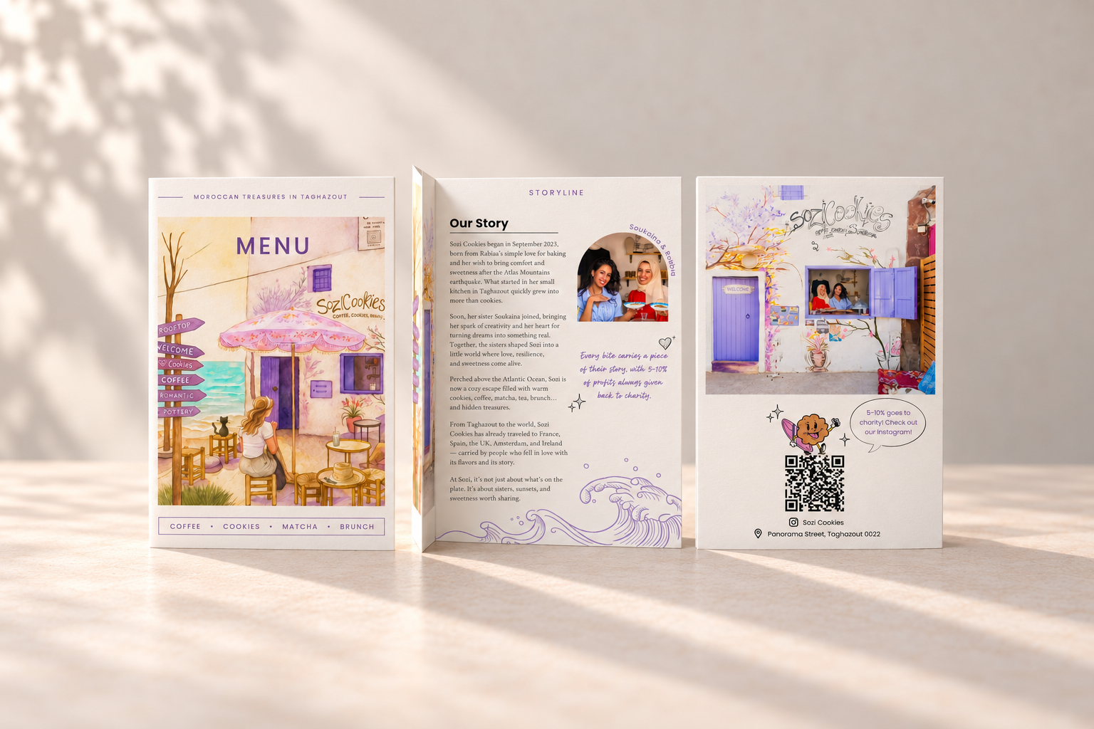 Printed menu mockup showing the illustrated cover, the sisters’ story and the back cover