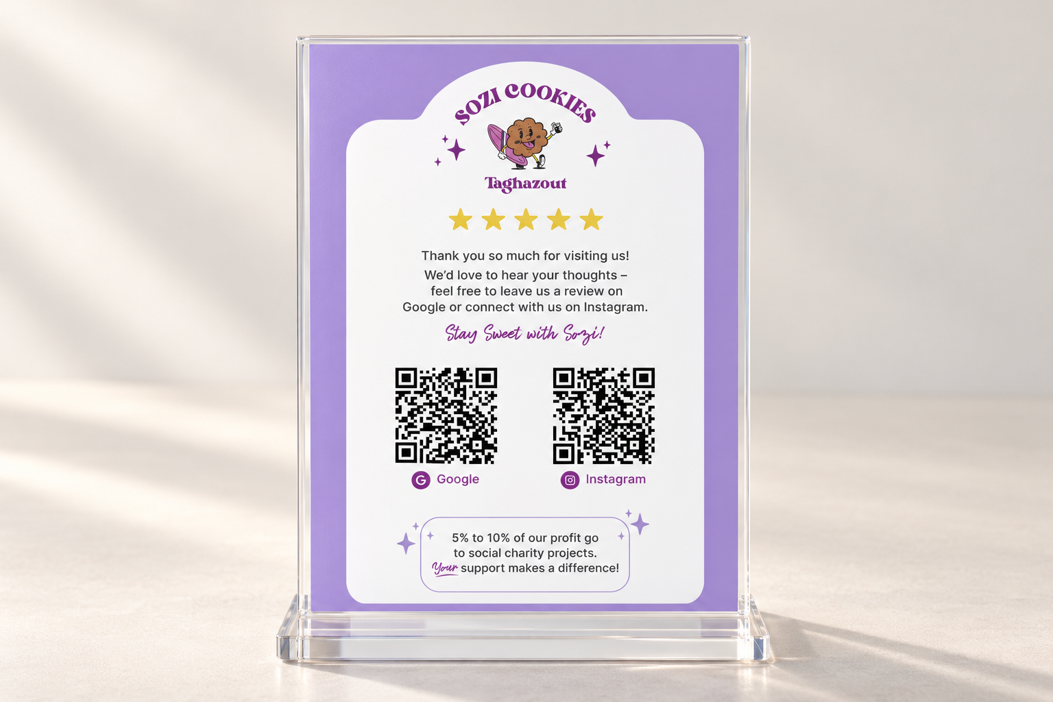 Google review and Instagram poster in an acrylic display on a soft neutral background